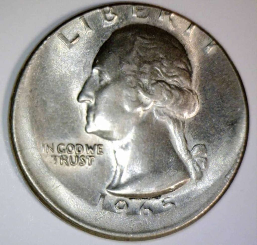 An off-center strike of a 1965 25 cents.